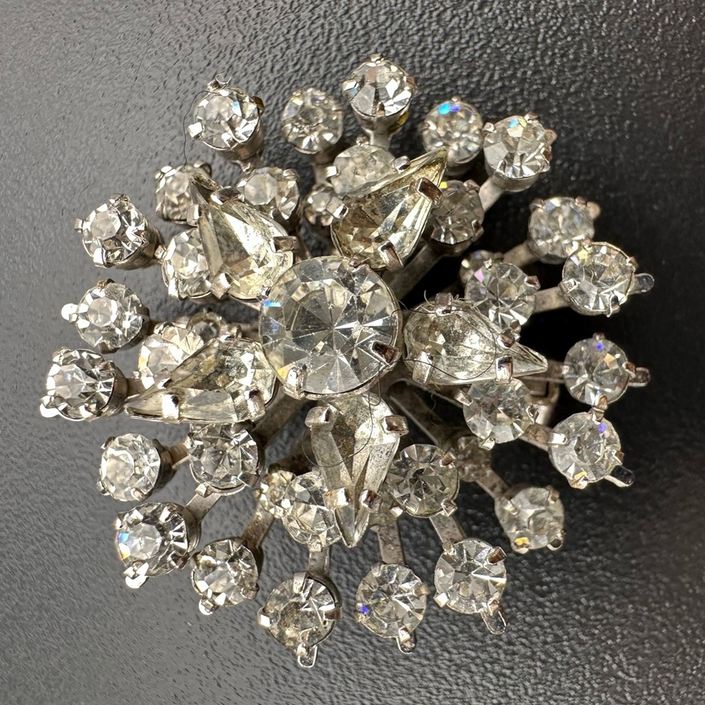 Vintage starburst or snowflake clear rhinestone cluster silver-tone brooch